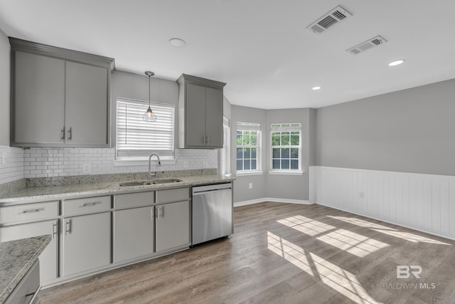24477 Harvester Dr, Loxley, AL 36551 - kitchen featuring stainless steel dishwasher, a sink, visible vents, and gray cabinetry