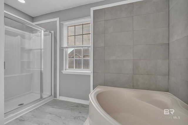 24477 Harvester Dr, Loxley, AL 36551 - full bath featuring a garden tub, baseboards, marble finish floor, and a stall shower