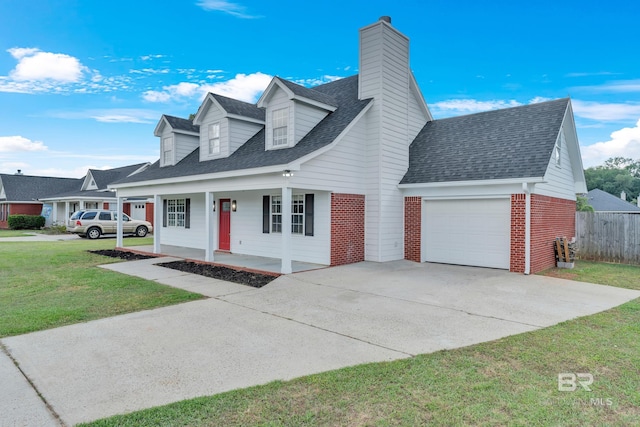 24477 Harvester Dr, Loxley, AL 36551 - cape cod-style house with brick siding, a garage, a porch, a chimney, and concrete driveway