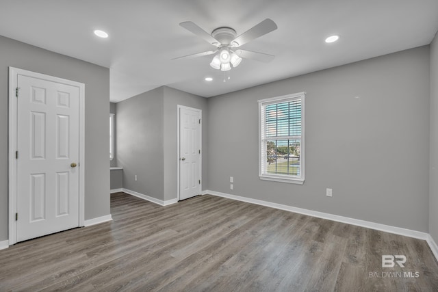 24477 Harvester Dr, Loxley, AL 36551 - unfurnished bedroom with recessed lighting, baseboards, ceiling fan, and wood finished floors