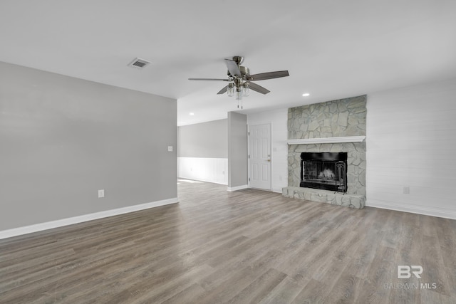 24477 Harvester Dr, Loxley, AL 36551 - unfurnished living room featuring ceiling fan, visible vents, wood finished floors, baseboards, and recessed lighting