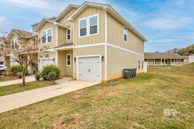 view of front of property featuring a garage and a front yard