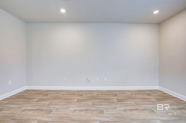 empty room with light hardwood / wood-style floors