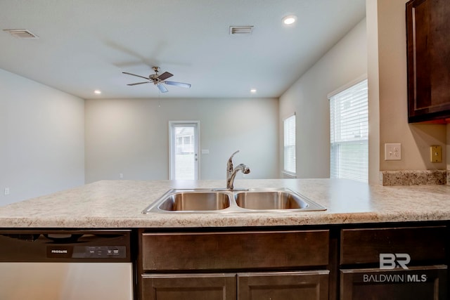 kitchen featuring a wealth of natural light, sink, stainless steel dishwasher, and dark brown cabinets