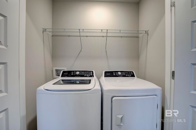 laundry room featuring separate washer and dryer