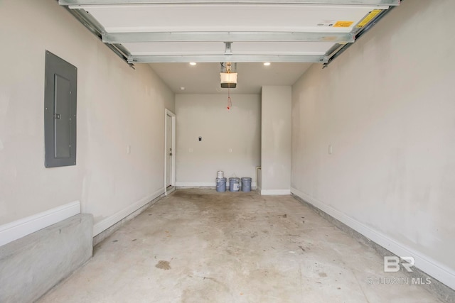 garage with a garage door opener and electric panel