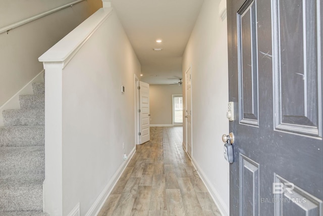 corridor featuring light hardwood / wood-style floors