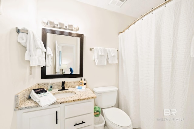 bathroom with toilet, curtained shower, visible vents, and vanity