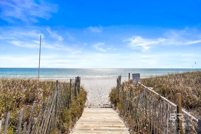 view of home's community featuring a view of the beach and a water view