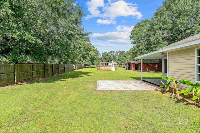 25779 Austin Rd, Daphne, AL 36526 - view of yard featuring a patio area and an outbuilding