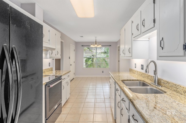 25779 Austin Rd, Daphne, AL 36526 - kitchen with freestanding refrigerator, electric stove, a sink, a chandelier, and white cabinets
