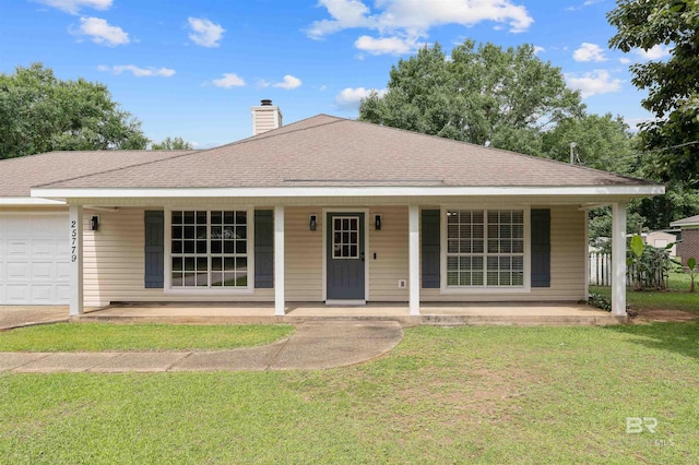 25779 Austin Rd, Daphne, AL 36526 - view of front of property with covered porch, a garage, a front yard, a chimney, and a shingled roof