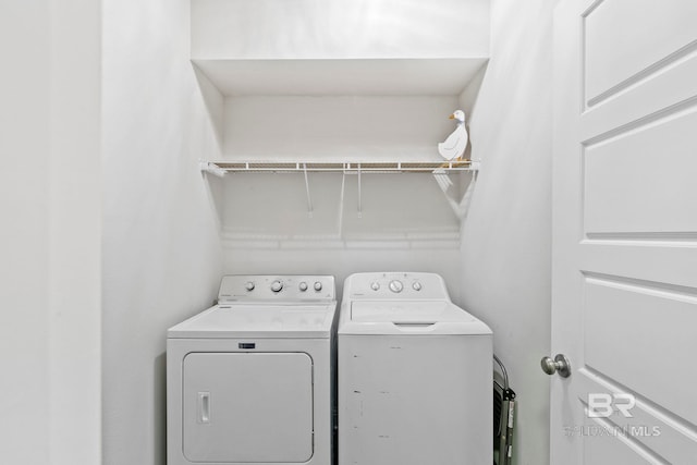 washroom featuring washing machine and dryer