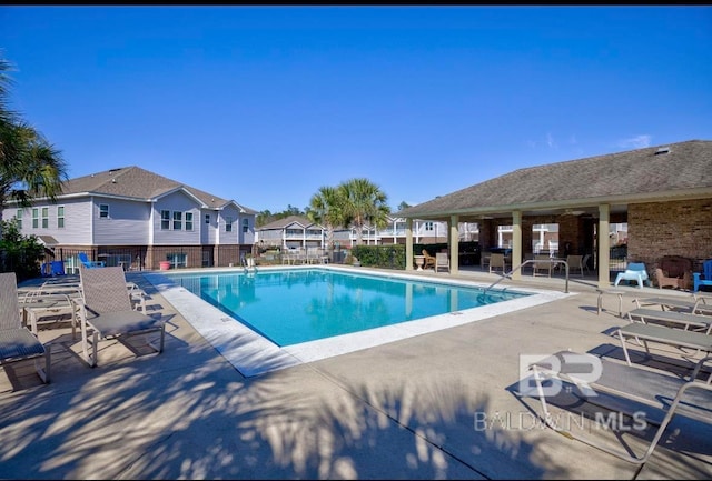 view of swimming pool with a patio