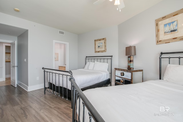 bedroom with ceiling fan and wood-type flooring