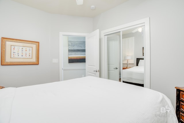 bedroom featuring ceiling fan and a closet