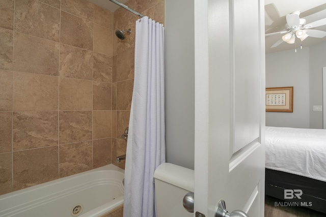 bathroom featuring ceiling fan and shower / tub combo with curtain