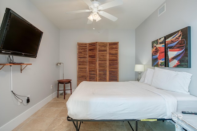 bedroom with light tile patterned floors and ceiling fan