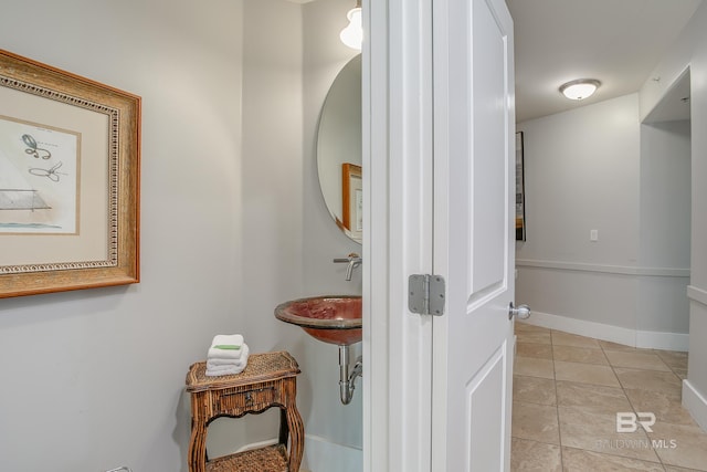 hallway featuring light tile patterned floors