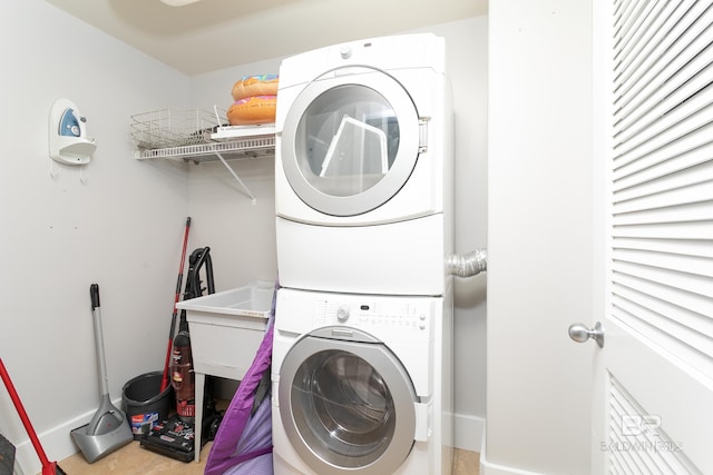 laundry room with stacked washer and dryer