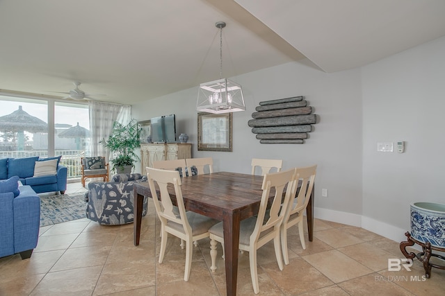 dining area with ceiling fan and light tile patterned floors