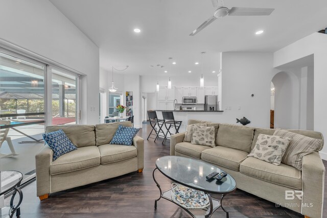 1352 W Fairway Dr, Gulf Shores, AL 36542 - living room with arched walkways, ceiling fan, recessed lighting, and dark wood-type flooring