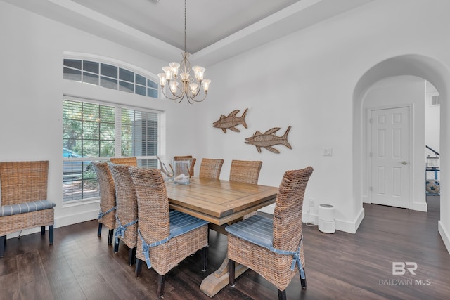 1352 W Fairway Dr, Gulf Shores, AL 36542 - dining area featuring an inviting chandelier, arched walkways, wood finished floors, and visible vents