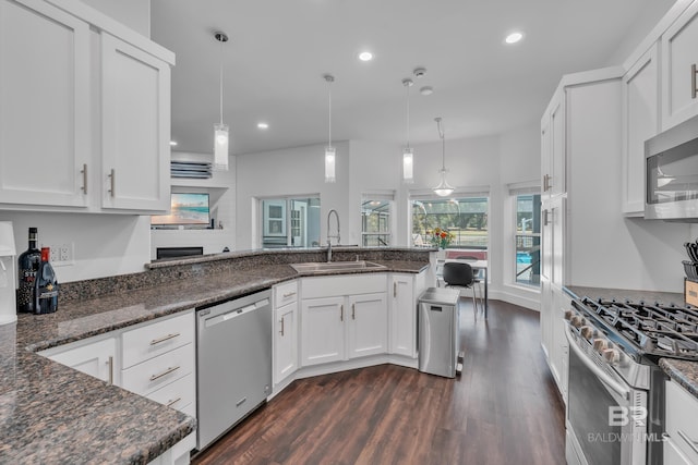 1352 W Fairway Dr, Gulf Shores, AL 36542 - kitchen featuring a sink, dark wood-style flooring, white cabinetry, and stainless steel appliances