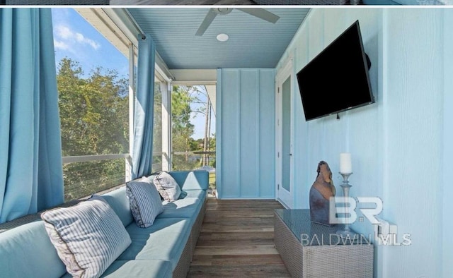 sunroom featuring ceiling fan