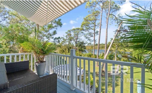 balcony featuring a water view