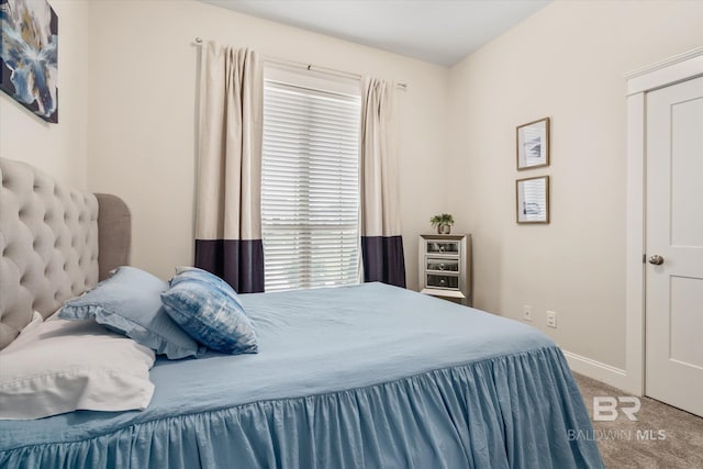 carpeted bedroom with baseboards