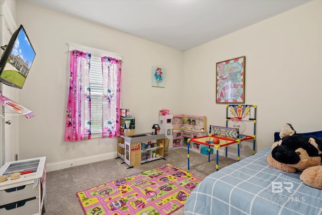 bedroom featuring baseboards and carpet flooring