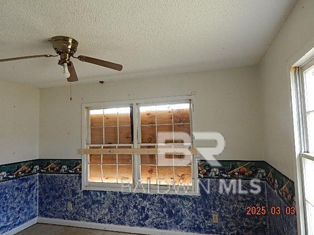 interior space with a textured ceiling