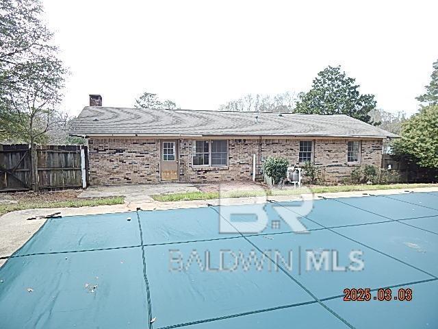 view of swimming pool with fence and a fenced in pool