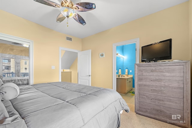 carpeted bedroom featuring ceiling fan and connected bathroom