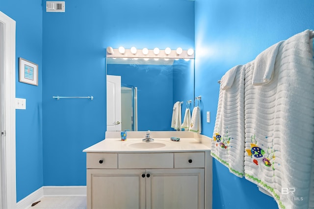 bathroom featuring tile patterned floors and vanity