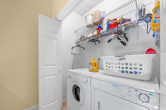 laundry room featuring separate washer and dryer