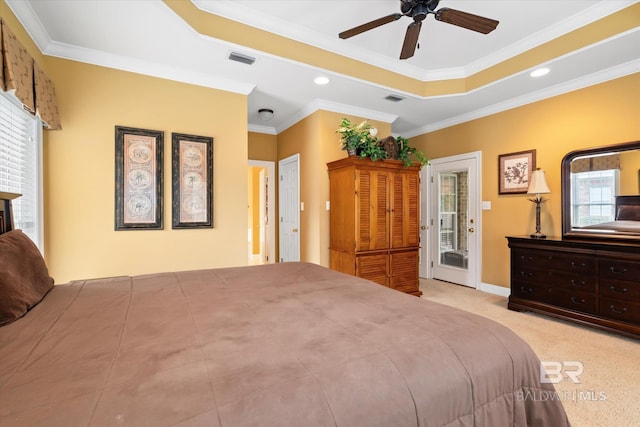 bedroom with a raised ceiling, access to outside, visible vents, and ornamental molding