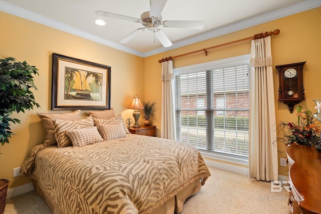 bedroom featuring light colored carpet, ceiling fan, baseboards, and ornamental molding