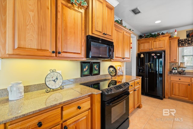 kitchen with visible vents, black appliances, ornamental molding, light tile patterned floors, and light stone countertops