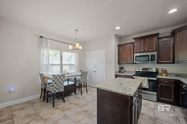 kitchen featuring dark brown cabinets, light stone countertops, stainless steel appliances, and a chandelier