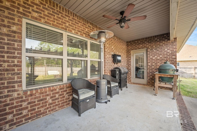 view of patio featuring a ceiling fan and a grill