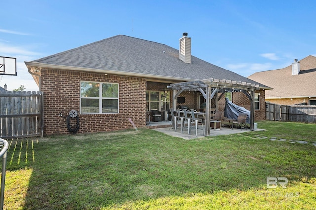 rear view of property with roof with shingles, a lawn, brick siding, a fenced backyard, and a pergola