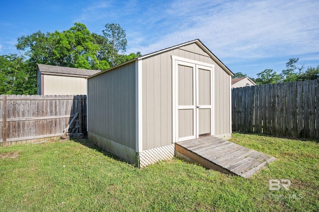 view of shed featuring a fenced backyard