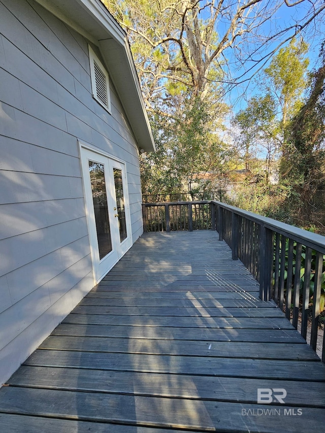 wooden deck featuring french doors