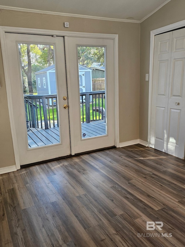 entryway featuring baseboards, french doors, dark wood-type flooring, and crown molding