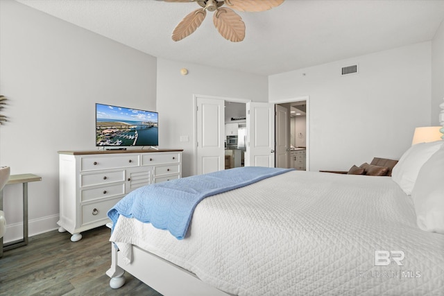 bedroom featuring ceiling fan and dark hardwood / wood-style floors