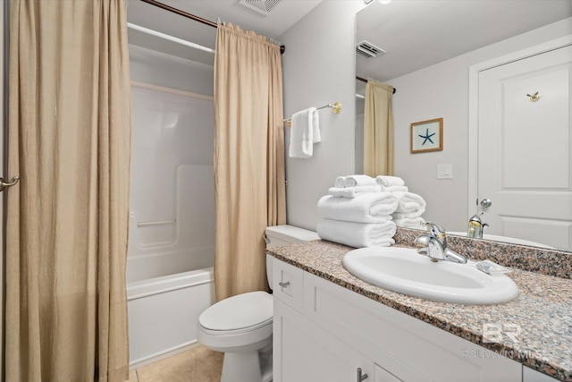 full bathroom featuring tile patterned floors, vanity, toilet, and shower / bath combo with shower curtain