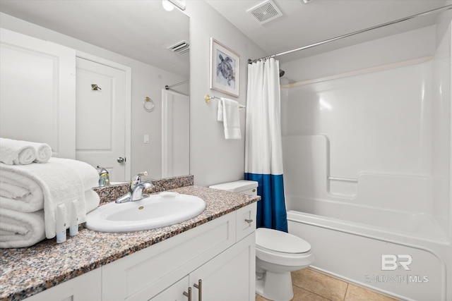 full bathroom featuring tile patterned flooring, vanity, toilet, and shower / bathtub combination with curtain