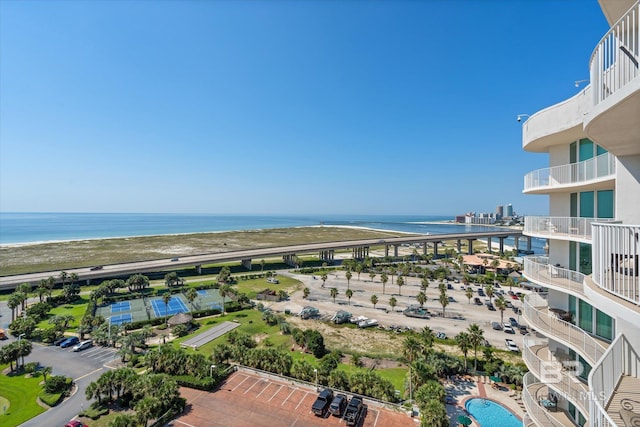 birds eye view of property with a water view and a view of the beach